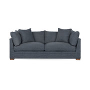 Classic Home Audrey stationary sofa with plush cushions and elegant design, showcasing a cozy living room setup.