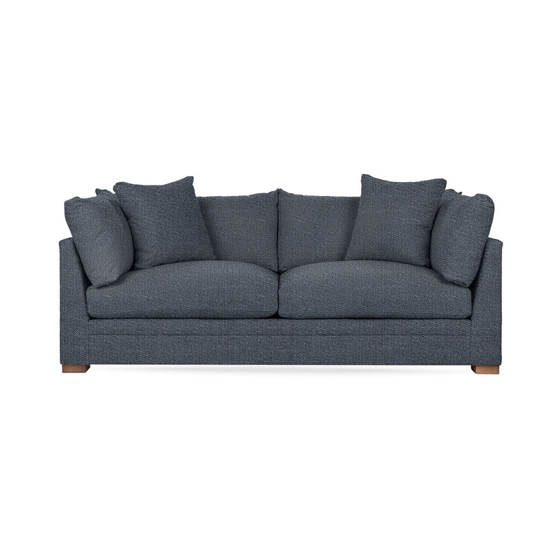 Classic Home Audrey stationary sofa with plush cushions and elegant design, showcasing a cozy living room setup.