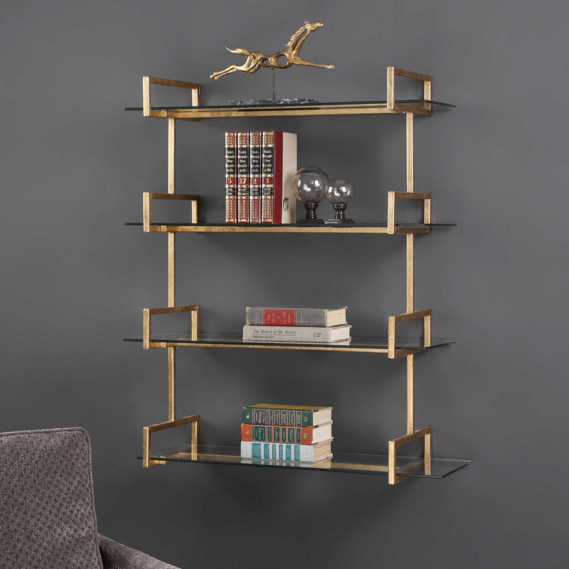 Gold wall shelf by Uttermost Auley, modern wall shelf with sleek gold finish and minimalist design, mounted on a wall.