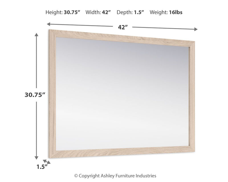 Signature Design by Ashley bedroom mirror from Cadmori collection, rectangular with a sleek wooden frame.