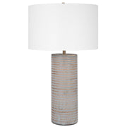 Gray Monolith table lamp by Uttermost with a sleek, modern design featuring a textured base and a fabric lampshade.