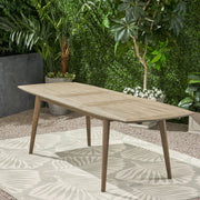 Noble House Placidity outdoor expandable dining table with slatted tabletop and tapered legs, perfect for patio dining.