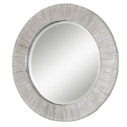 Uttermost Repose round wall mirror with whitewash finish, decorative wooden frame, and reflective glass surface.