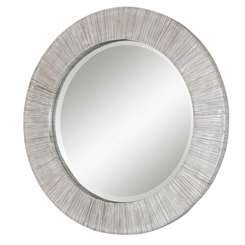 Uttermost Repose round wall mirror with whitewash finish, decorative wooden frame, and reflective glass surface.