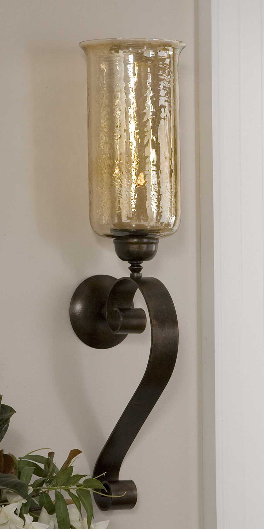 Joselyn bronze candle wall sconce by Uttermost, featuring a stylish design with a candle holder on a decorative wall mount.