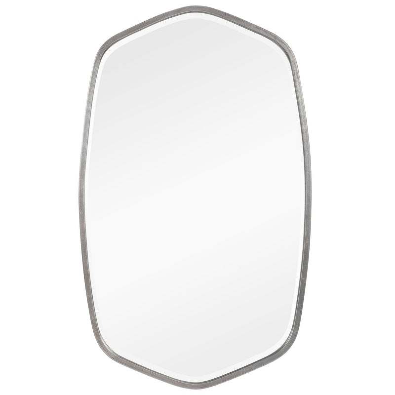 Uttermost Duronia iron wall mirror with a sleek, round frame hanging on a wall, reflecting a modern interior.