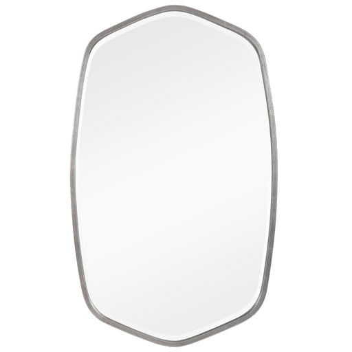 Uttermost Duronia iron wall mirror with a sleek, round frame hanging on a wall, reflecting a modern interior.