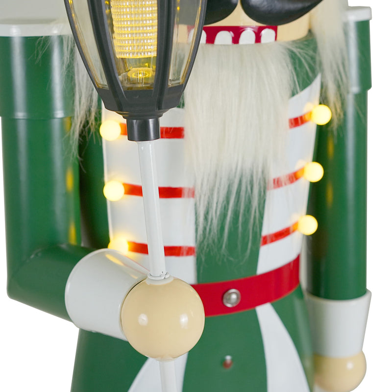 Noble House classic nutcracker Christmas decor in green, red, and white with durable construction, festive holiday decoration.