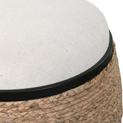 Uttermost Island straw accent stool with white and light brown woven design and wooden legs, suitable for modern interior decor.
