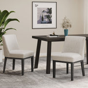Set of two Noble House modern dining chairs with durable fabric upholstery and sturdy wooden frames, perfect for stylish dining rooms.