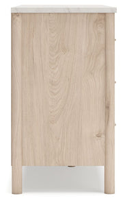 Signature Design by Ashley Cadmori six-drawer dresser with dark wood finish and modern handles, showcasing spacious storage.