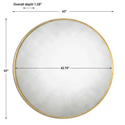 Uttermost Junius round wall mirror with a sleek frame, hanging on a wall, showcasing modern home decor style.