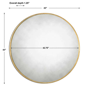 Uttermost Junius round wall mirror with a sleek frame, hanging on a wall, showcasing modern home decor style.