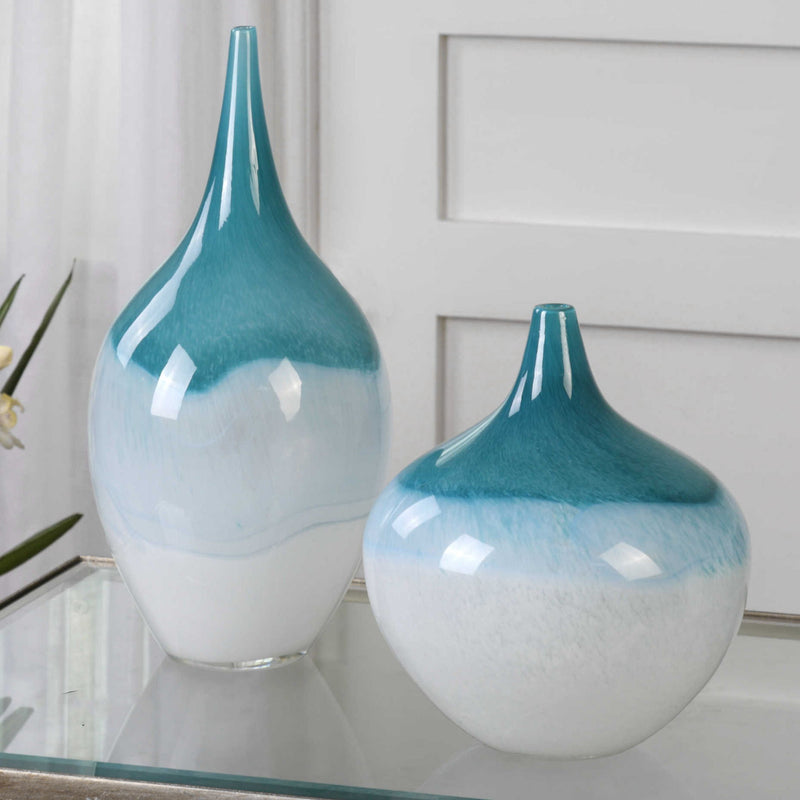 Set of two Uttermost Carla vases in white and teal, featuring elegant ceramic design and smooth, rounded shapes.