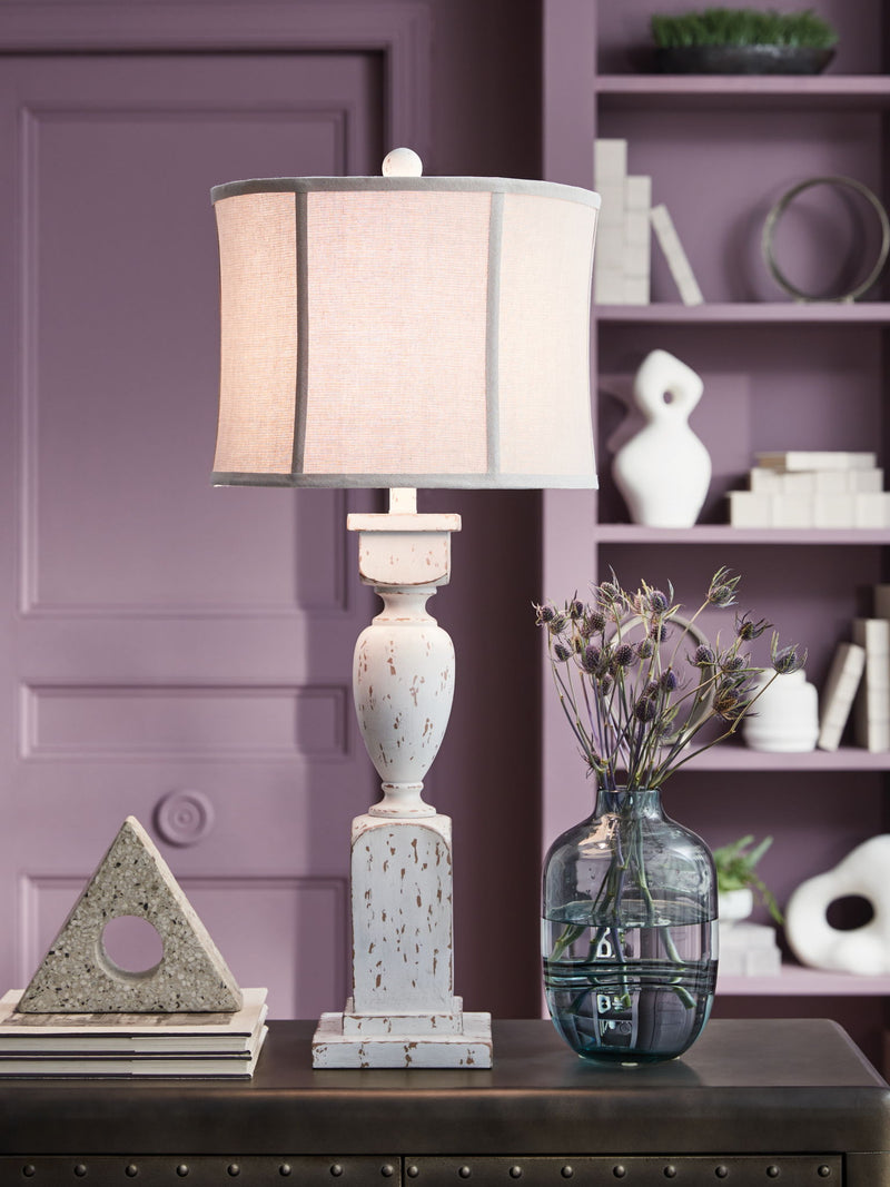 Signature Design by Ashley Madsbrook Poly Floor Lamp with a sleek modern base and a tall fabric lampshade.