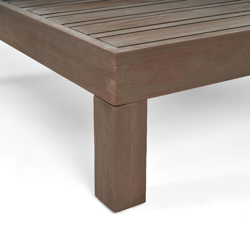 Rustic gray Noble House Oana Brava coffee table with slat panel design, showcasing a sturdy wooden construction and modern style.