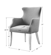 Blue Uttermost Yareena Wingback Chair with curved wooden legs and plush upholstery, showcasing a stylish, modern design.