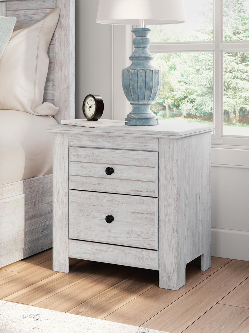 Signature Design by Ashley Makidern two-drawer nightstand with built-in charging station and modern wood finish.