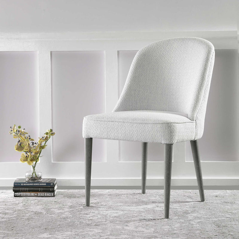 Set of two Uttermost Brie armless chairs with neutral upholstery and modern design, shown from a front angle.