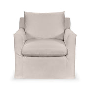 Classic Home Cassiano swivel chair with a plush fabric seat and a sturdy base, shown in a modern living room setting.