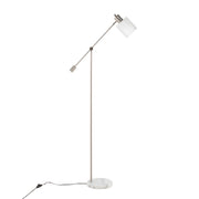 Lumi Source Marcel contemporary glam floor lamp with sleek metal stand and drum-shaped shade in a modern living room setting
