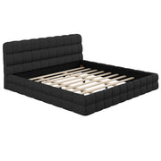 Dreamland upholstered platform bed with padded headboard and sleek frame, showcasing a modern bedroom setup.