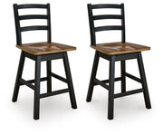 Pair of Wildenauer swivel stools by Signature Design by Ashley®, featuring wooden seats and metal bases in a modern design.
