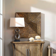 Uttermost Blaise wall art in antiqued bronze finish, decorative wall decor with intricate metal design and textured surface.