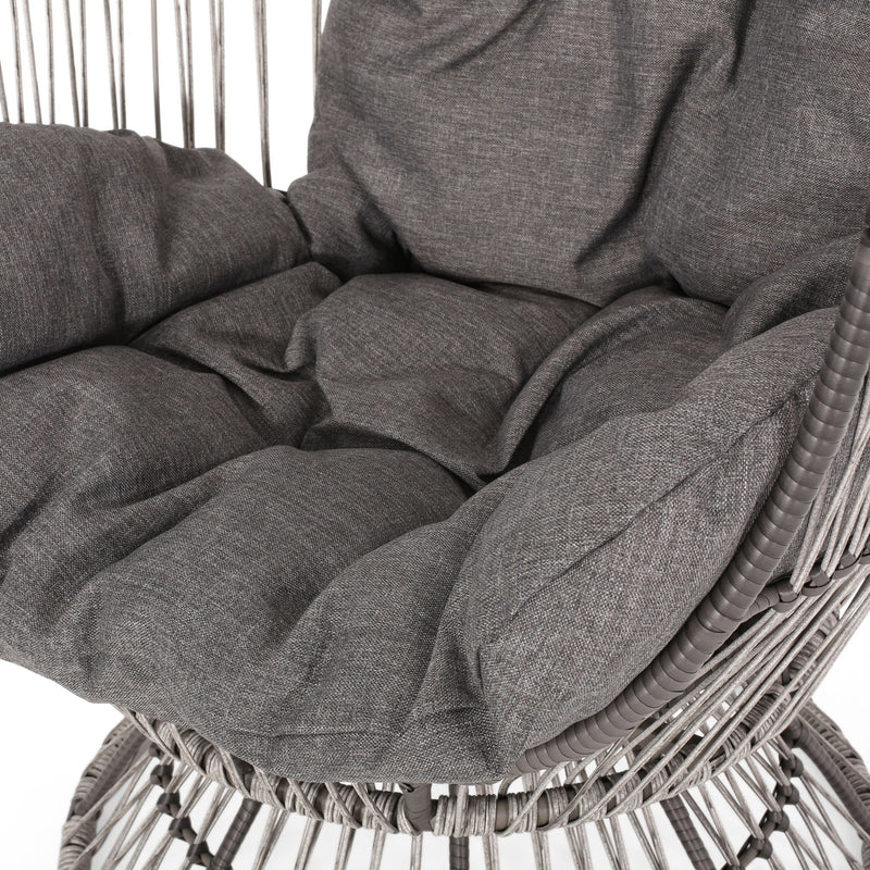 Noble House patio swivel basket egg chair with cushion, outdoor accent chair featuring a woven basket design and plush seating.
