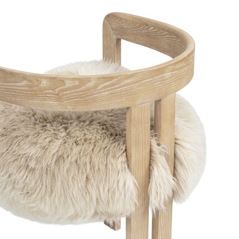 Jennifer Taylor Home Millwick low back dining arm chair in natural blonde wood with a sleek, modern design and cushioned seat.