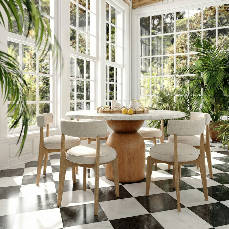 Cream fabric TOV Furniture Nikita side dining chair with sleek modern design and wooden legs.