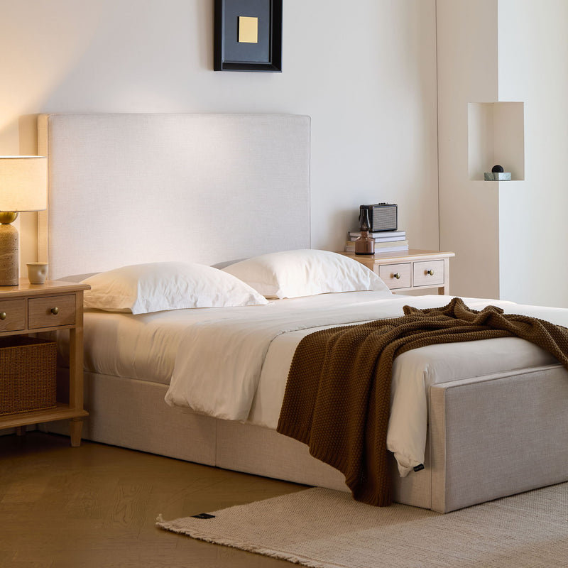 House & Home Furniture Lucas upholstered tall headboard on a bed, showcasing plush fabric and modern design for stylish bedroom decor.