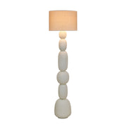 TOV Furniture Pebble Papier Mache Table Lamp with rounded pebble design in neutral tones on a wooden surface