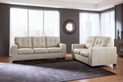 Signature Design by Ashley Santorine living room set with stationary chair and ottoman, featuring plush upholstery and modern style.