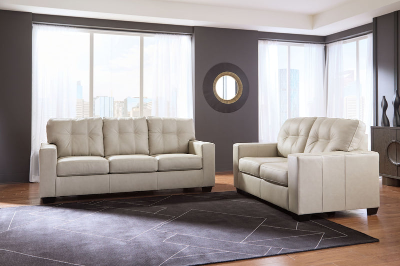 Signature Design by Ashley Santorine living room set with stationary chair and ottoman, featuring plush upholstery and modern style.