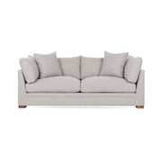 Classic Home Audrey stationary sofa with plush fabric and elegant design, shown in a cozy living room setting.