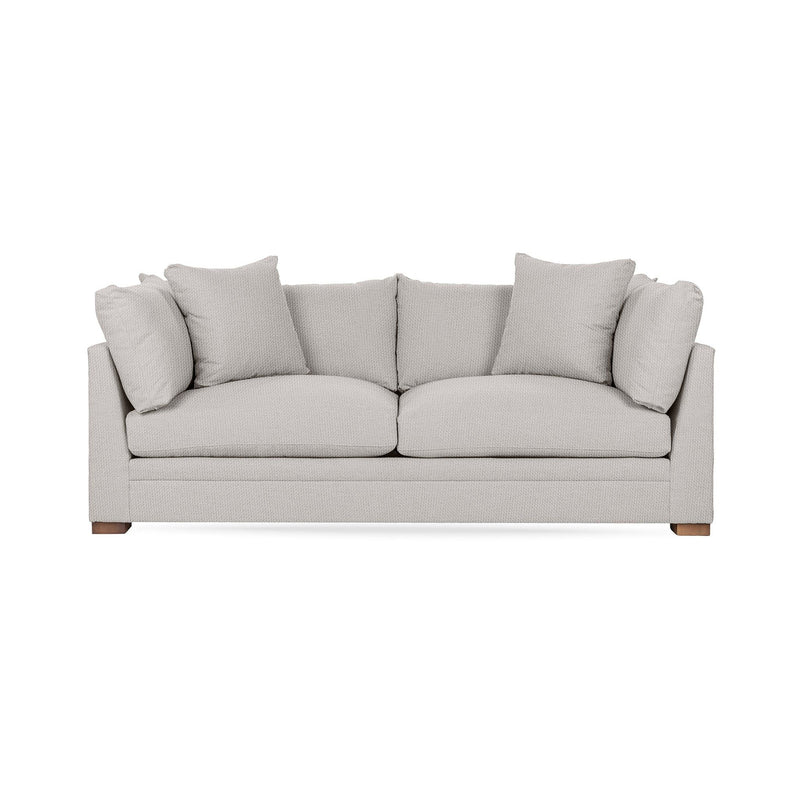 Classic Home Audrey stationary sofa with plush fabric and elegant design, shown in a cozy living room setting.