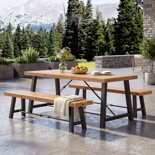 Noble House Catriona 3-piece teak wood outdoor dining set with table and chairs on patio, stylish and durable for outdoor dining.