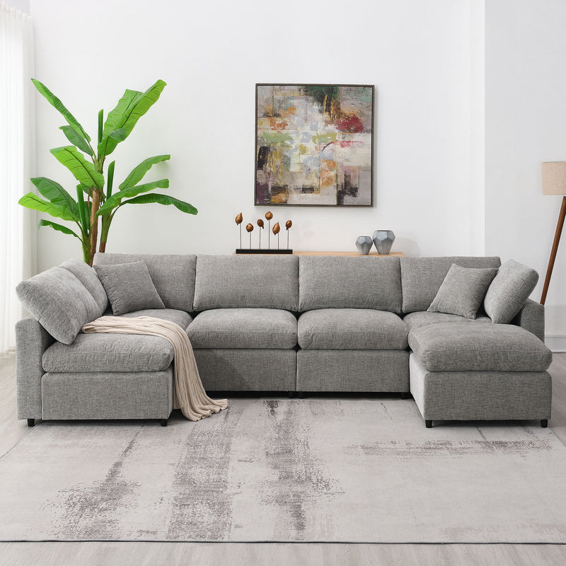 Modern Luxe & Co. cloud sectional sofa bed with six seats and ottoman, convertible U-shaped sleeper for stylish living room lounging.