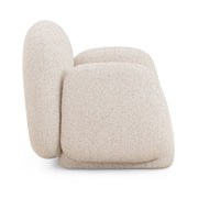 TOV Furniture Marius accent arm chair with plush fabric and modern design, featuring a curved back and tapered wooden legs.