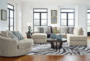 Benchcraft Calnita 3-piece living room set with sofa, loveseat, and armchair featuring neutral upholstery and modern design.