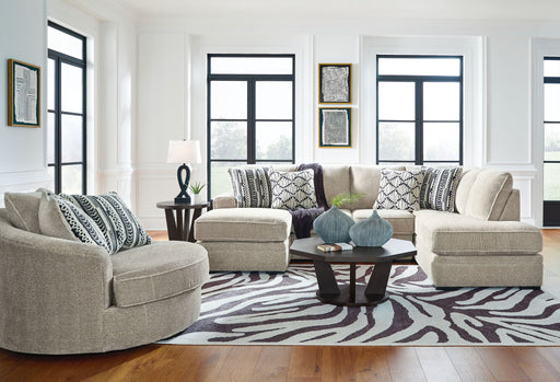 Benchcraft Calnita 3-piece living room set with sofa, loveseat, and armchair featuring neutral upholstery and modern design.
