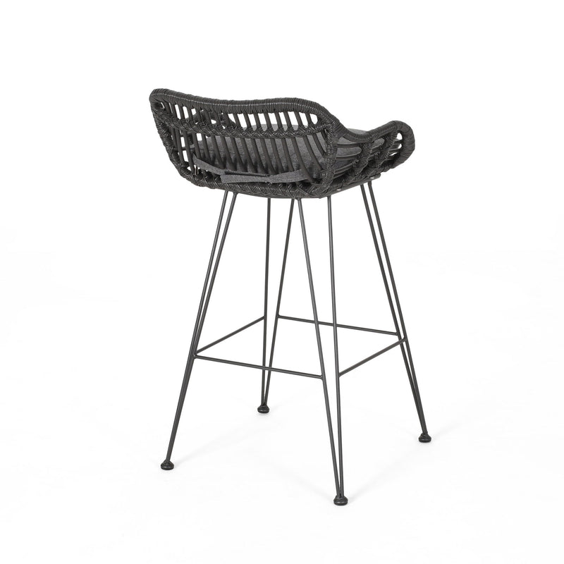 Noble House outdoor rattan bar stool with metal legs, featuring a stylish woven rattan seat and sturdy metal frame for outdoor use.