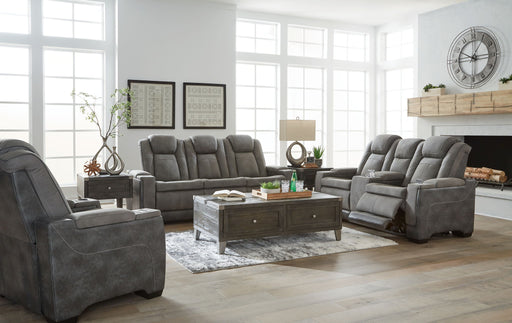 Signature Design by Ashley Next-Gen Durapella reclining sofa and loveseat set in a modern living room with plush cushions and reclining features.