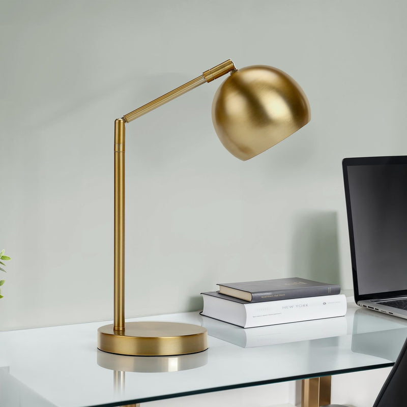 Contemporary gold table lamp by 8th Street with sleek design and cylindrical shade, perfect for modern living spaces.