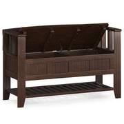 Simpli-Home Acadian entryway storage bench with brown finish and shelf, featuring cushioned seat and functional storage space.
