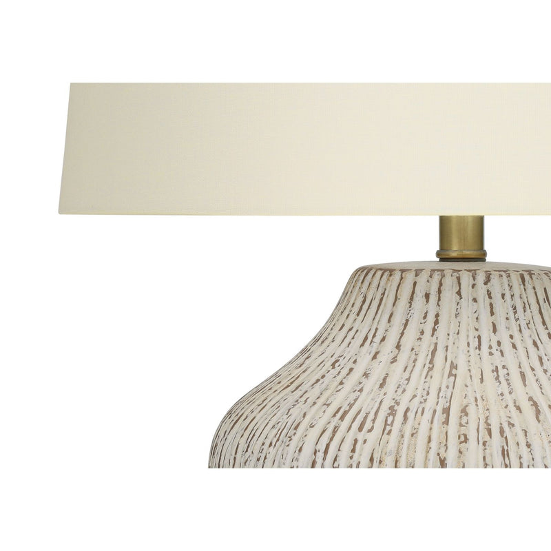Cream ceramic transitional table lamp by 8th Street with a stylish, modern design and a smooth finish.