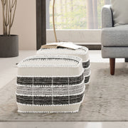 Square barley accent pouf in white, beige, and black by Simpli-Home, showcasing soft fabric and modern design for versatile seating.