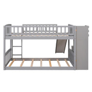 Gray DreamHaus twin over twin bunk bed with stairway, built-in drawers, and slide, perfect for kids’ bedrooms.