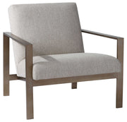 Contemporary beige accent arm chair by Uttermost with sleek design and plush upholstery, perfect for modern living spaces.